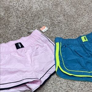 2 Free people movement running shorts NWT 

PINK/black and green/yellow pair
